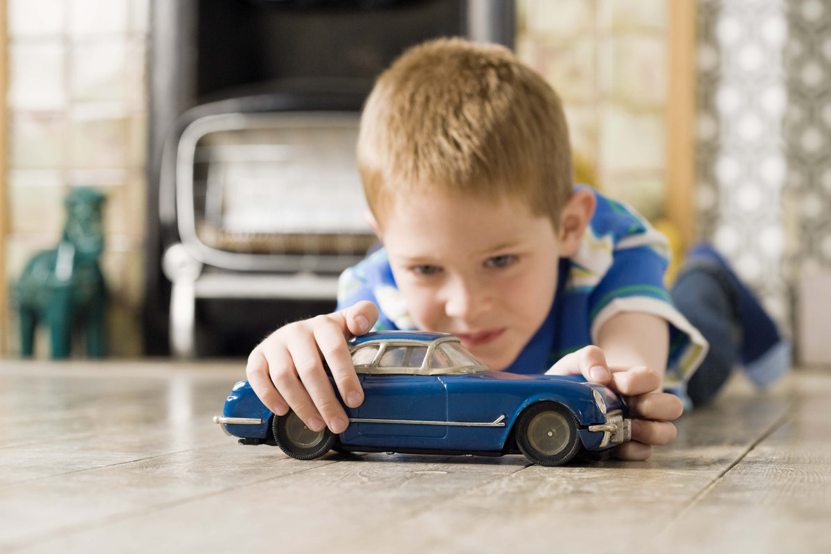 Playing cars. Boys playing with cars. Boy with a car.